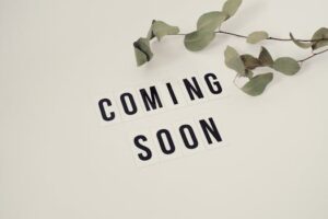 Eucalyptus branch with 'Coming Soon' message on white background for announcements.